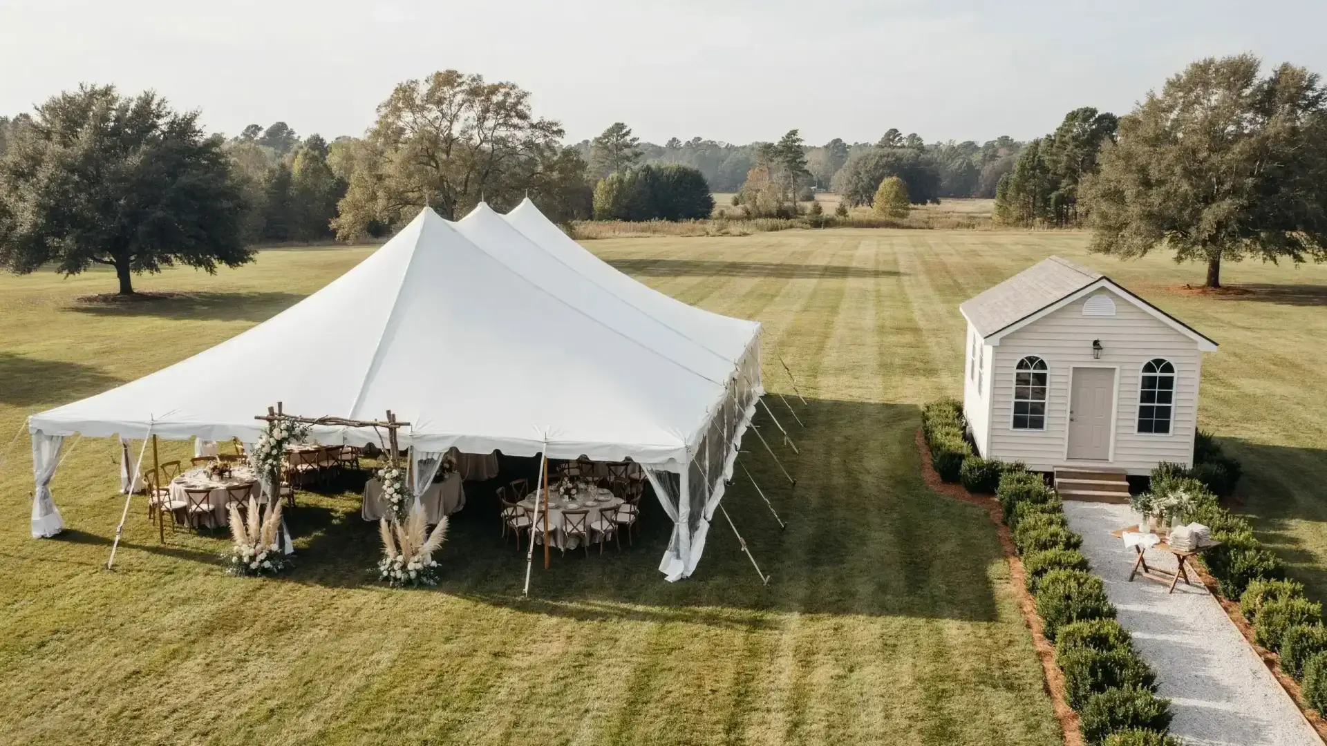 Tent wedding layout showing restroom trailer placement relative to the reception tent.